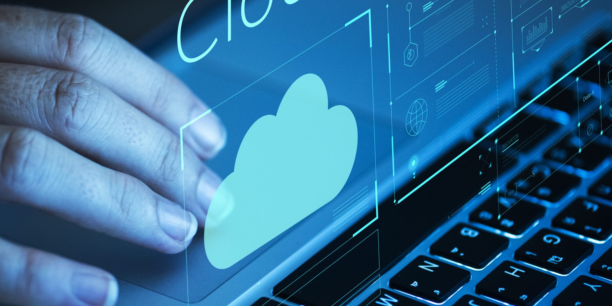 Woman scrolling on a laptop