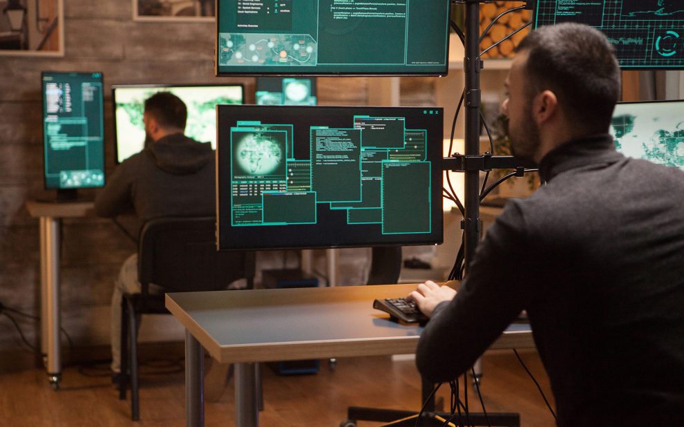 Back view of dangerous team of hackers